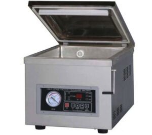 E10 vacuum packaging machine with digital control panel and gauge, open lid displaying interior.