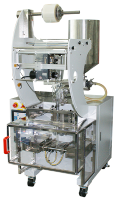 Industrial packaging machine with a 3s64L on top, a central cylindrical component, and a transparent safety enclosure.