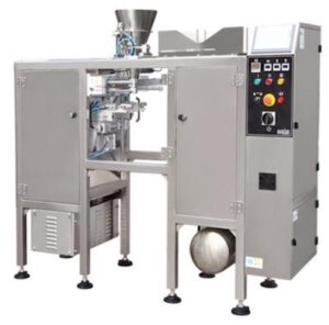 Industrial packaging machine PMB1 with control panel, hopper, and sealed unit on a factory floor.
